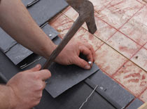 Nailing new roof asphalt shingles