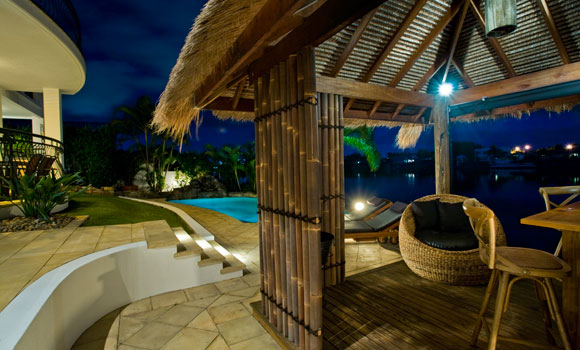 Backyard Tiki House by pool