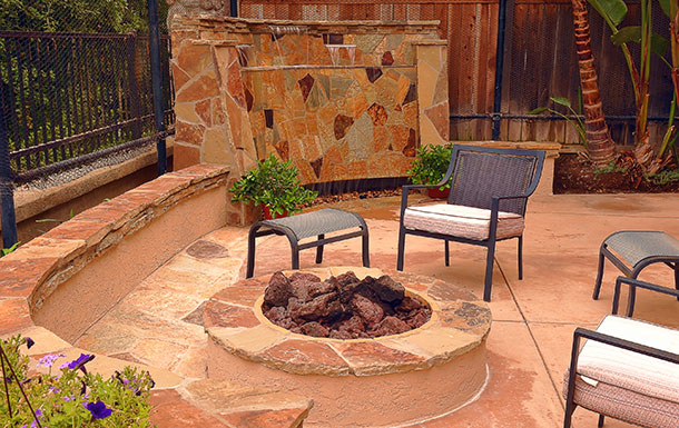 custom patio fire pit and waterfall