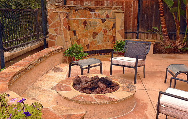 custom patio fire pit and waterfall