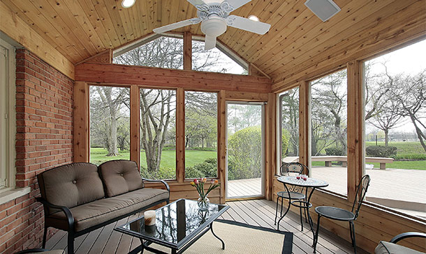 Patio furniture in wood porch enclosure