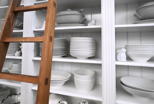 open kitchen shelves with white dishes