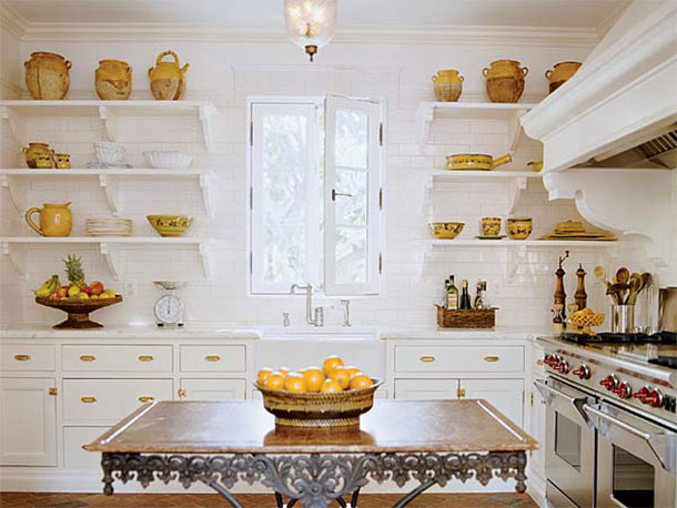 Open shelves in white and gold candy shop kitchen
