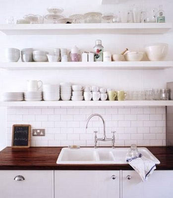 White tile and wood kitchen with open shelving